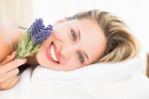 Woman smiling and holding lavendar